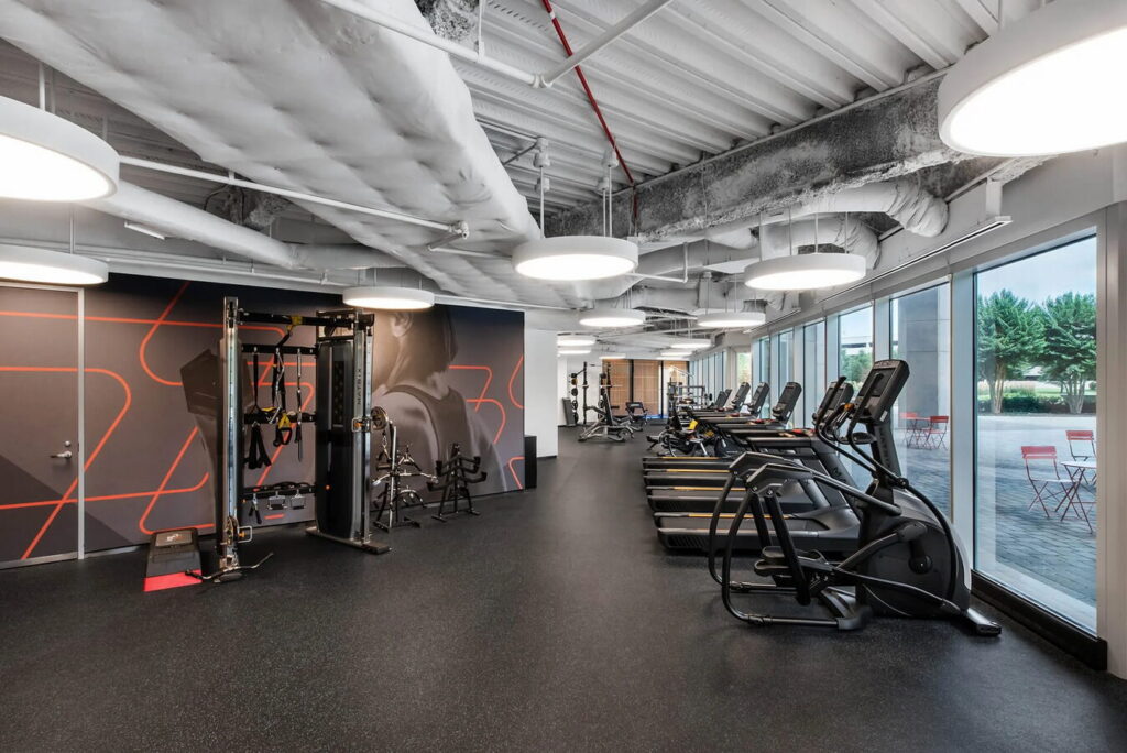 Complimentary fitness center with cardio and strength equipment for Pioneer Office Suites members in Bethesda