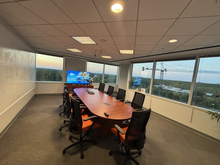 Conference Room A with oval table, large display and panoramic windows in Bethesda, MD