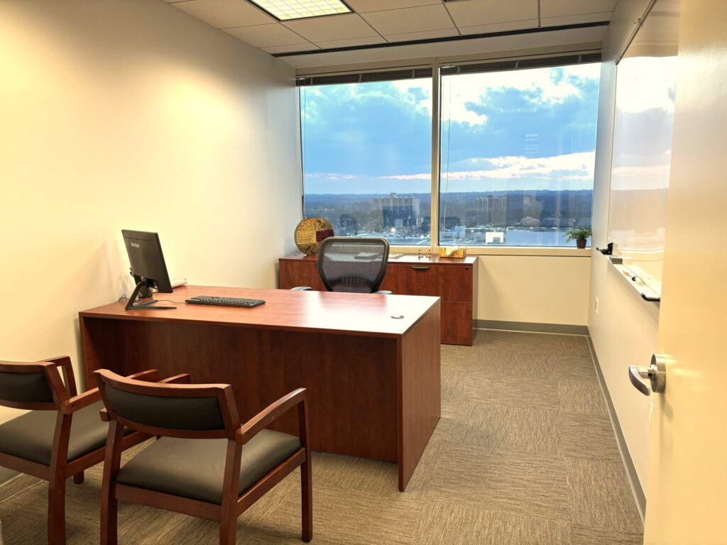 Executive private office with desk, credenza and guest chairs at Pioneer Office Suites in Bethesda