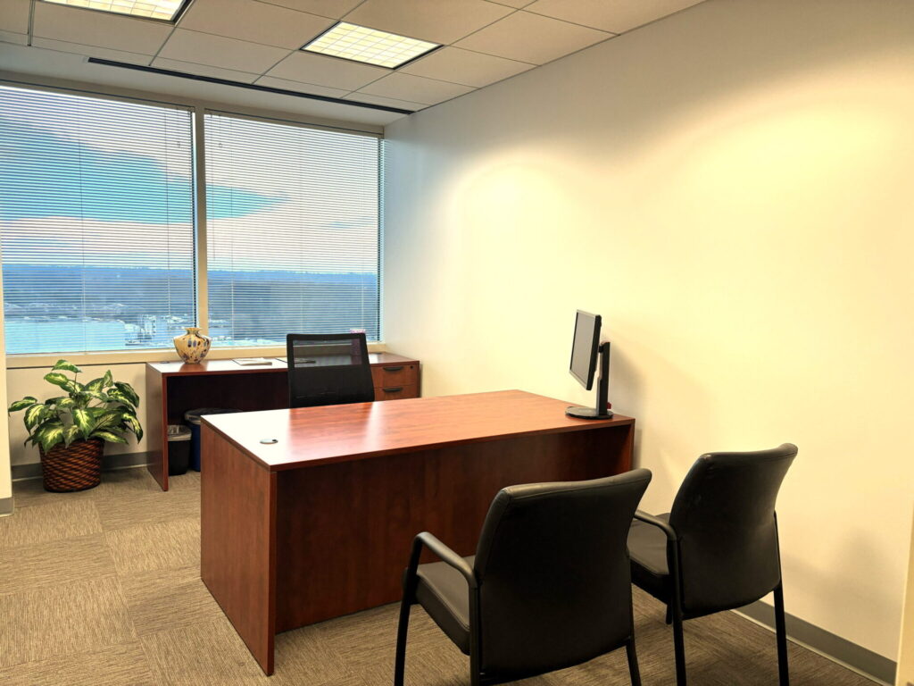 Furnished private office with cherry wood desk and window view for rent in Bethesda, MD