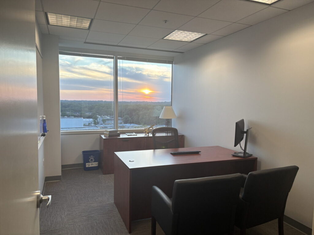 Furnished private office with a sunset window view, ready for immediate occupancy in Bethesda, MD