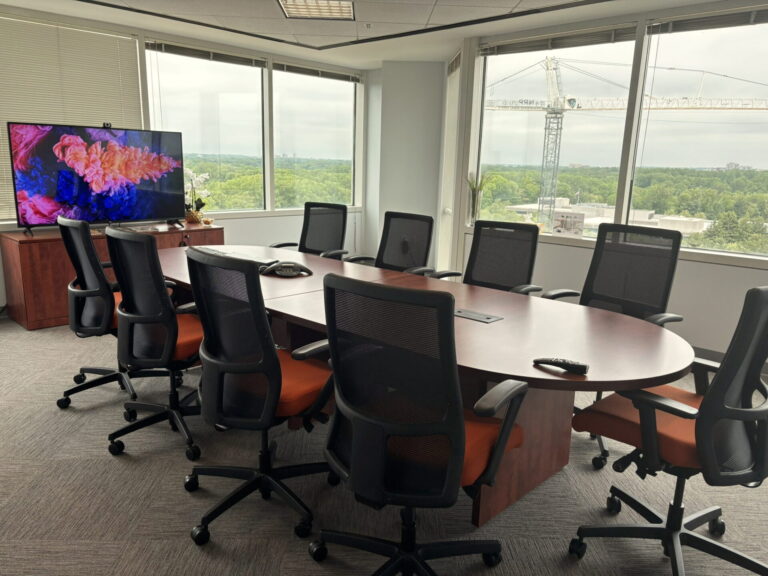 Boardroom-style meeting room with display for presentations and video calls in Bethesda, MD