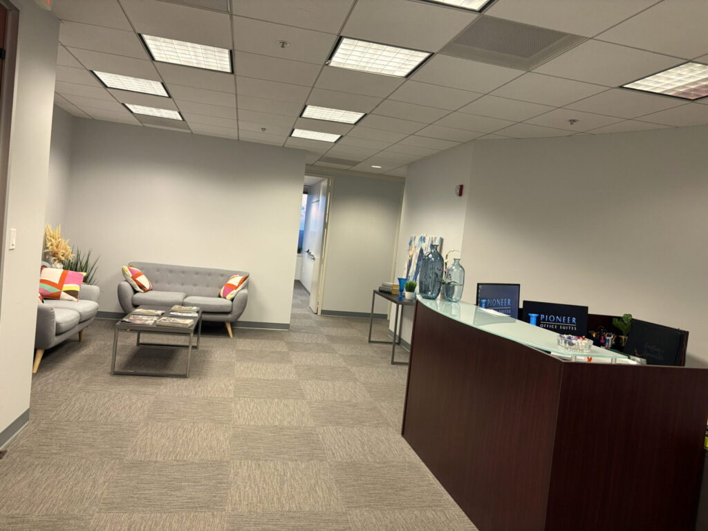 Shared reception and lounge seating for coworking members at Pioneer Office Suites in Bethesda