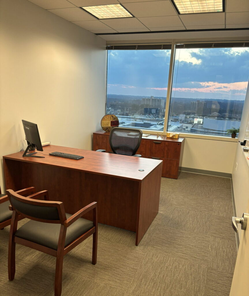 Private office for one with desk and guest chair at Pioneer Office Suites in Bethesda